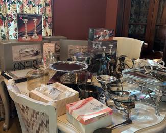 Lots of silver serving ware, some new, never opened