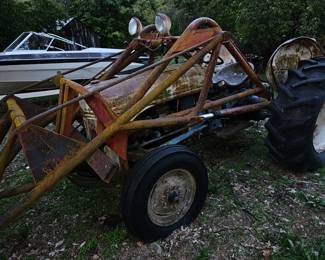 Side view Fird Tractor, boat in back ground