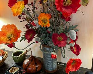 Floral arrangements, gourds, vintage books
