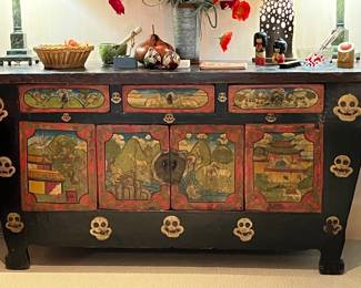Tibetan cabinet/buffet/dresser with three small drawers and shelving in cabinet below. Hand painted with dark stain