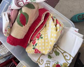 Beautiful vintage linens all over the place!