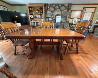 This table had two leafs and is very large when they are attached. This table is perfect for Holiday  guests and is solid wood!
