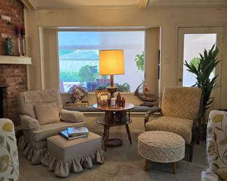 assorted occasional chairs - some with ottomans, a variety of tables in several sizes, this double-decker is solid wood from the 1960s and it's showcasing a vintage, Early American-style table lamp