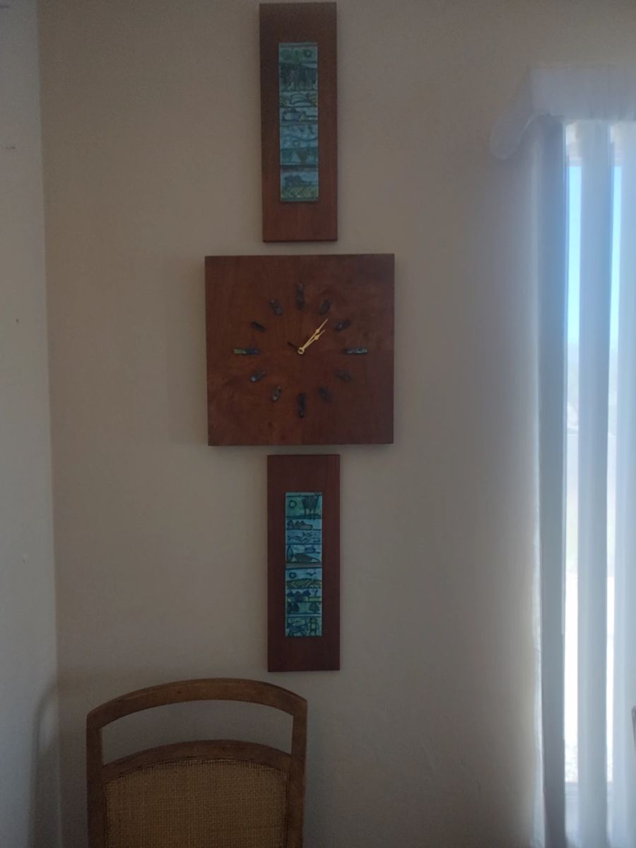 MCM walnut and tile clock and accent pieces by Harris G. Strong.