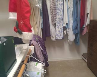 Master bedroom closet has sheet sets. blankets, and tablecloths