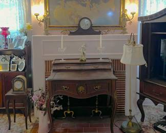 I know this is similar to the previous picture, but the mantel clock is on the mantel.  Beneath it is the small secretary's desk.