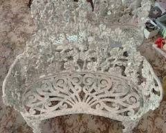 Remember the pair of wrought iron chairs and glass-topped table?  This loveseat could be yours with those!