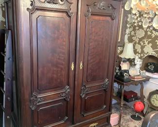 This could be an entertainment center, or it could be an armoire.  You know the curiosity is building....