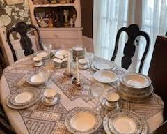 In this dining room scene, a different pattern of dishware is shown.