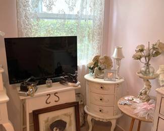 The corner lingerie cabinet is not the biggest, but it has a certain charm to it.  Like many of the sales, there are also framed artwork available.