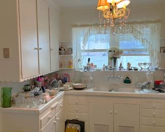 This is a different look of the kitchen utensils, glasses, pots, pans, etc.