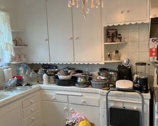 Several pots and pans, and other kitchen tools and appliances are available.