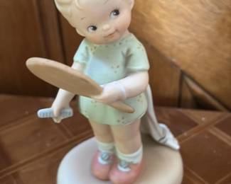 Porcelain Figurine of a Girl with a Racket