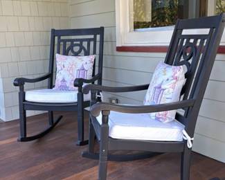 Black Rocking Chair with Pagoda and Bird Motif Pillow