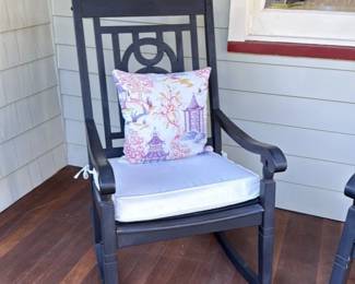 Black Rocking Chair with Pagoda and Bird Motif Pillow