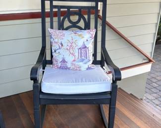 Black Rocking Chair with Pagoda and Bird Motif Pillow