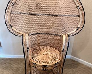 Mid-Century Peacock Chair
This striking mid-century rattan peacock chair features an elaborate fan-back design with intricate woven details, evoking timeless bohemian elegance.