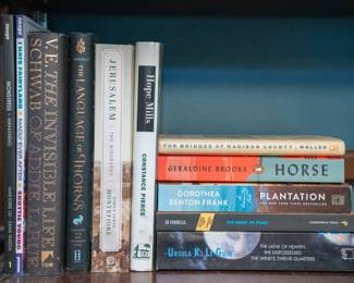 Vintage books including The Bridges of Madison County by Robert James Waller, Plantation by Dorothea Benton Frank, The Invisible Life of Addie LaRue by V. E. Schwab