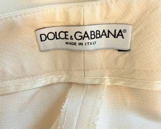 Closeup of pair of Dolce & Gabbana off white linen pants made in Italy