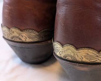 Closeup of the vintage brown leather cowboy boots rockabilly country