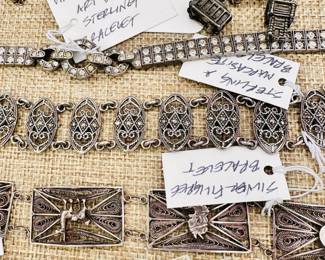 Closeup of the sterling silver and marcasite bracelet, vintage sterling silver Art Deco bracelet, vintage silver filigree bracelet, faceted crystal necklace 
