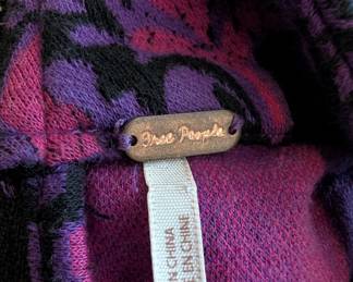 Closeup of the Free People pink and purple pattern sleeveless mini dress