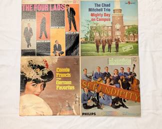 Vintage vinyl record albums including The Four Lads Breezin' Along, Connie Francis Sings German Favorites, and The Serendipity Singers
