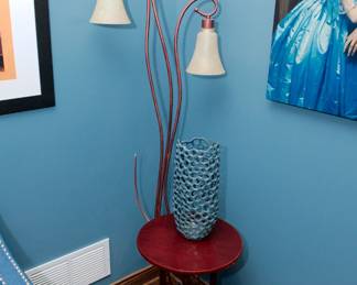 A vintage copper and three-light floor lamp, a Motivo Designs Gabrielle ceramic vase, wooden round top occasional table