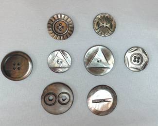 Vintage mother of pearl buttons are just some of the button collections available – see all the sewing supplies, dress maker's form, sewing table, and lots of books about sewing at this estate sale!