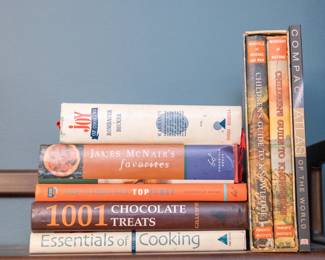 Cookbooks including the Joy of Cooking, James McNair's Favorites, 1001 Chocolate Treats, Essentials of Cooking, How to Cook Like A Top Chef