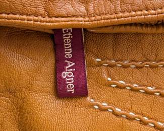 Closeup of pair of Etienne Aigner women's leather gloves