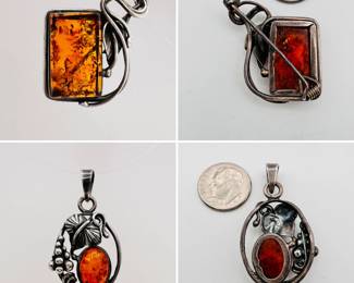 Two vintage sterling silver and amber pendants