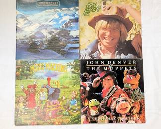 Vinyl record albums including John Denver & The Muppets, John Denver's Greatest Hits, and John Denver Rocky Mountain Christmas