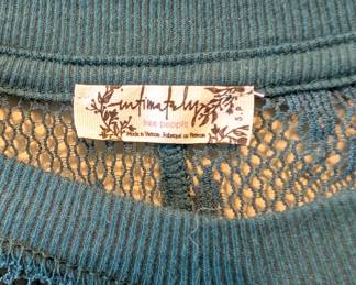 Closeup of Free People blue knit lace floral top