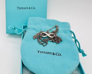 Another view of the Tiffany & Co. sterling silver infinity pendant necklace in original packaging