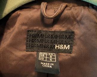 Closeup of H&M brown Nappa leather blazer style long sleeved jacket size 4