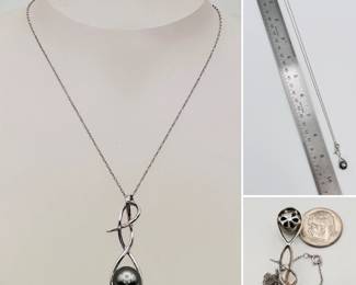 A 10k white gold and black pearl pendant necklace