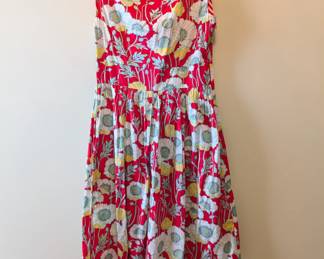 Sleeveless red sun dress with poppy pattern
