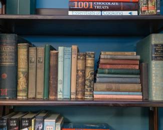 Antique and vintage books including a 19th century Gately's Universal Educator, The Leather Stocking Tales by James Fenimore Cooper, Doctor Dolittle's Post Office and Doctor Dolittle's Zoo by Hugh Lofting, and the Complete Works of William Shakespeare illustrated by Rockwell Kent