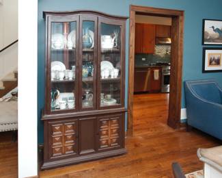 A vintage wood carved china cabinet