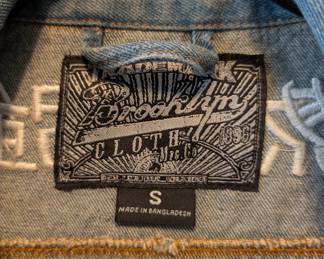 Closeup of the vintage Brooklyn Cloth Survival of the Fittest denim jacket size S