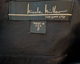 Closeup of the Nicole Miller New York City formal black dress, mid-length, size 2