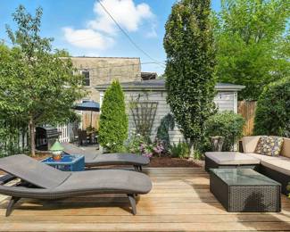 Another view of the cool outdoor furniture including a set consisting of rattan wicker reclining lounge chairs,  coffee table with glass top, and a cozy couch