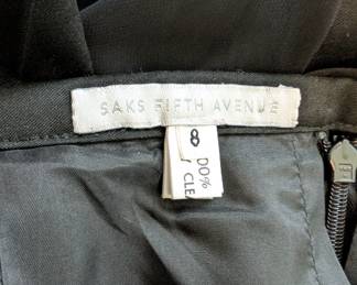 Closeup of the Saks Fifth Avenue black pleated mid-length skirt, size 8