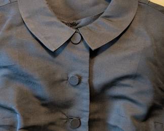 Closeup of the charming 50s/60s little black dress with matching bolero jacket