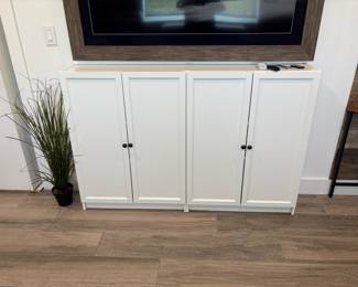 White Wooden Four-Door Cabinet (attached to the wall)