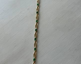 J6- $1250 - 8" bracelet 14kt gold & (2 1/2 to 3 ctw of emeralds) - 12.1 gr.