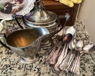 #91 - $60 - Grouping of early silver plated creamer & sugar, & flatware.