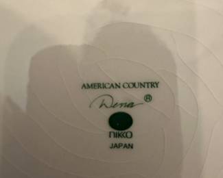 #142 - $120 - American Country Dena dishes, 8 dinner plates, 10 salad plates, 8 saucers, 7 cups, 1 large serving bowl, 2 small serving bowls, sugar & creamer, 1 oval serving plater