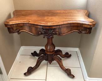 #1 - $500 - 19th century Rococo Revival burl walnut console game table, serpentine apron with carved flowers.
